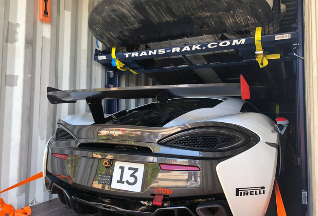 A Mclaren which is being shipped safely in a container