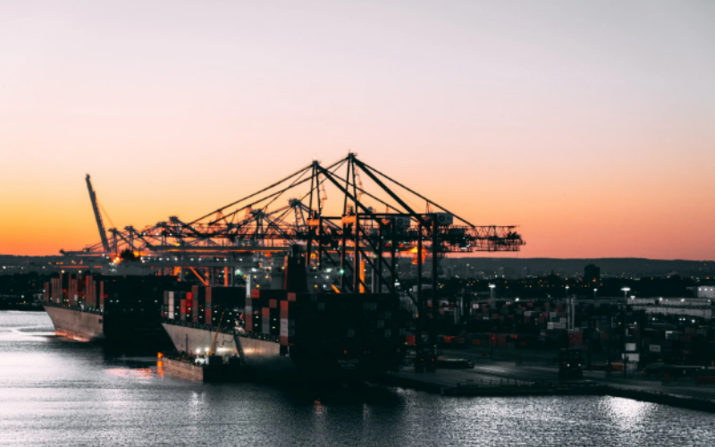 A port with cranes showing Trans-Rak's Global Impact With The New Shipping Corridor