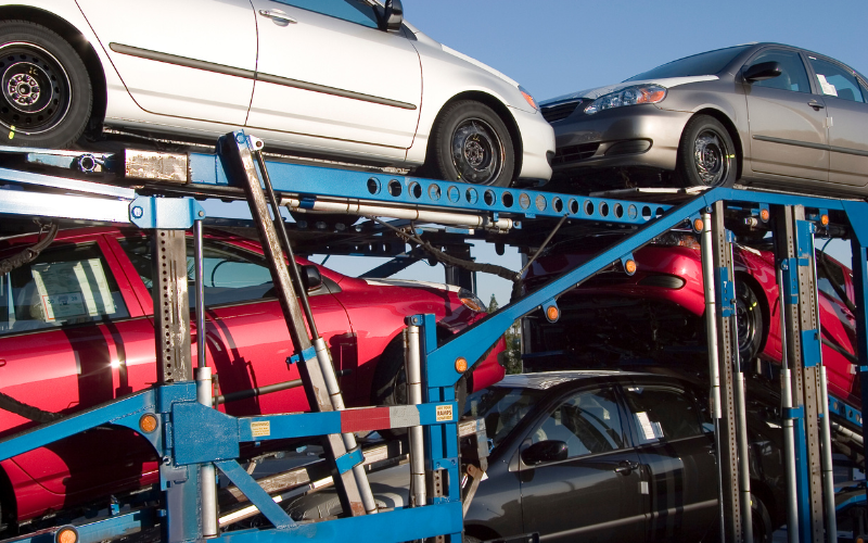 Cars being help up by reusable transport racks